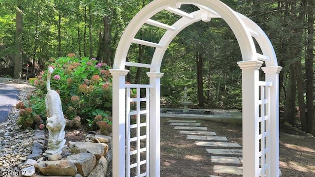 details with arched walkways and a forest view