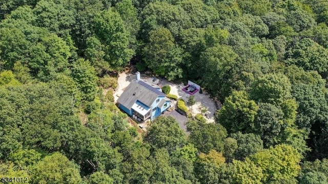 bird's eye view featuring a forest view