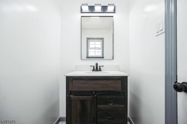 bathroom featuring vanity and baseboards