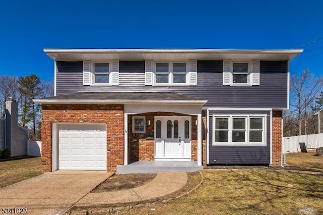 view of front facade with fence, driveway, a front lawn, a garage, and brick siding