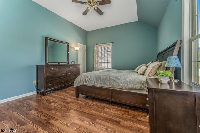 bedroom with vaulted ceiling, wood finished floors, a ceiling fan, and baseboards