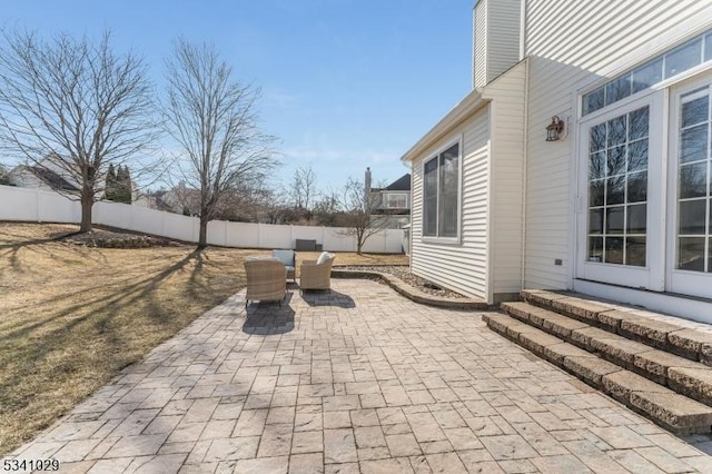 view of patio featuring entry steps and a fenced backyard