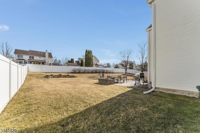 view of yard with a fenced backyard and a patio