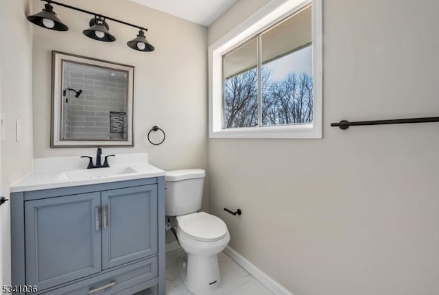 full bathroom with toilet, marble finish floor, baseboards, walk in shower, and vanity