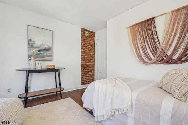 bedroom featuring wood finished floors