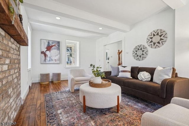 living area featuring beamed ceiling, recessed lighting, baseboards, and hardwood / wood-style flooring