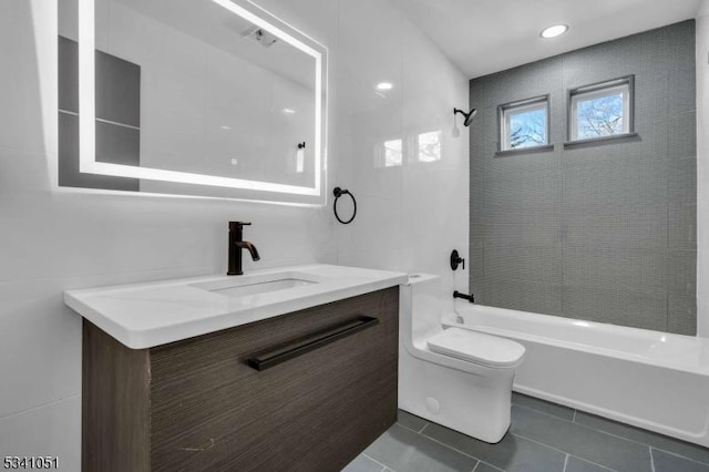 bathroom featuring toilet, tile patterned flooring, bathtub / shower combination, and vanity