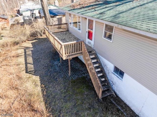 exterior space featuring stairway and a wooden deck