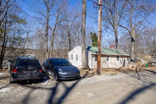 view of side of property with a chimney