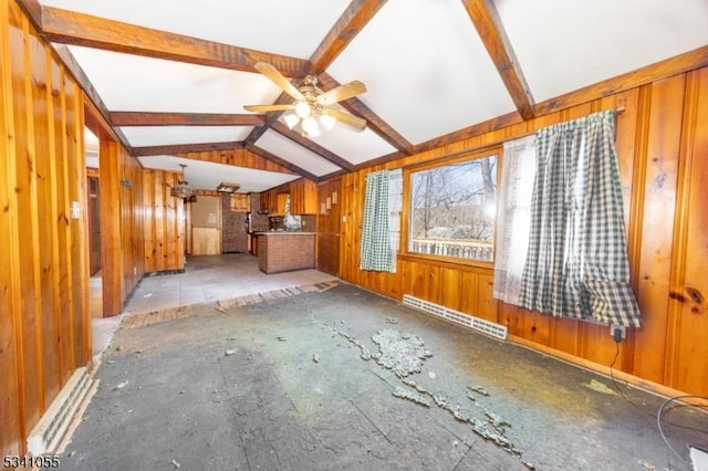 unfurnished living room featuring vaulted ceiling with beams, ceiling fan, wooden walls, and a baseboard heating unit