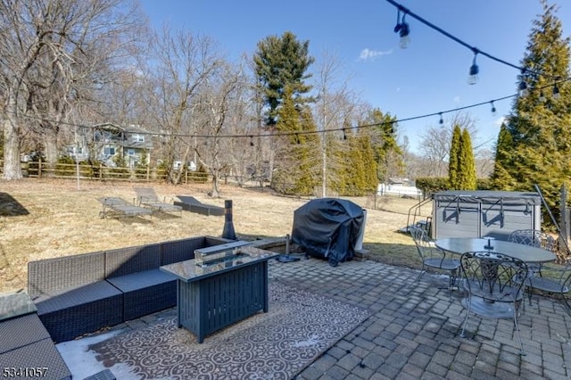 view of patio featuring outdoor dining space, a fenced backyard, an outdoor hangout area, and area for grilling