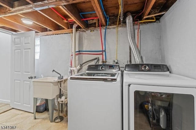 laundry room with washing machine and dryer and laundry area