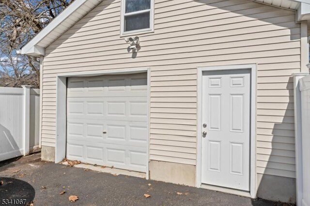 garage featuring fence