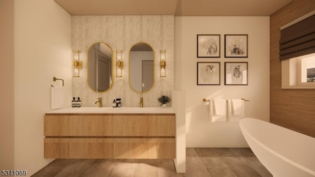 full bathroom with a freestanding bath, vanity, and tile patterned floors