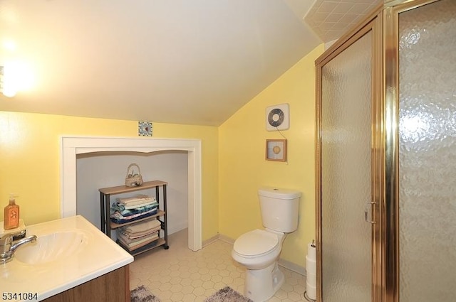 full bathroom featuring lofted ceiling, toilet, vanity, baseboards, and a stall shower