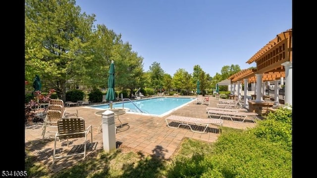 pool with a patio