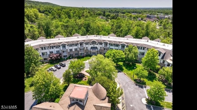 drone / aerial view with a view of trees