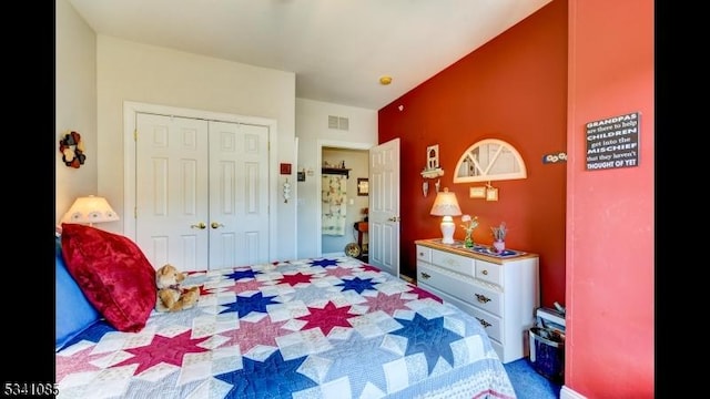 bedroom featuring a closet and visible vents