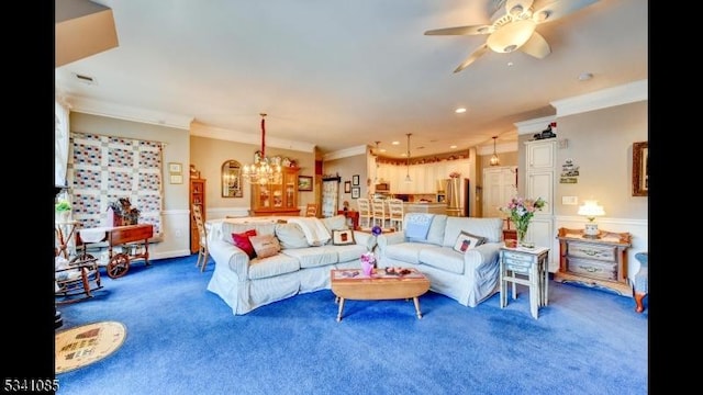 living room with ornamental molding, carpet, and ceiling fan with notable chandelier