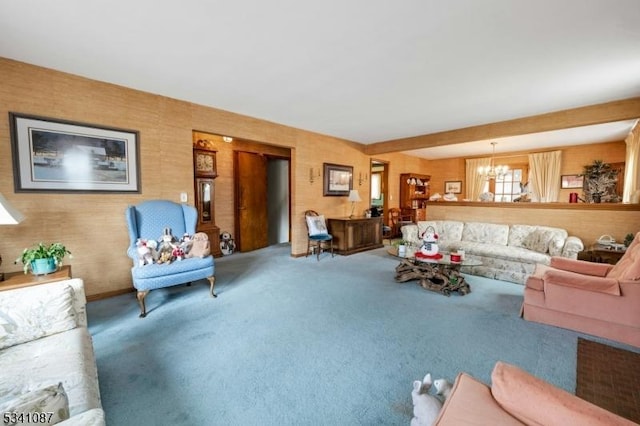 living room featuring carpet floors and a notable chandelier