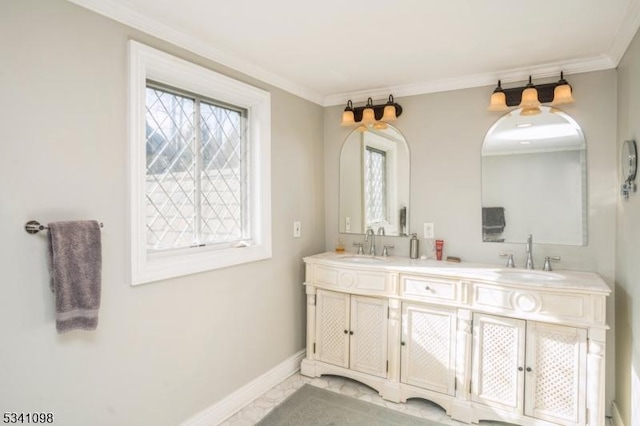 full bathroom with double vanity, crown molding, baseboards, and a sink