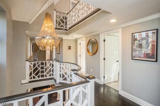 corridor with crown molding, recessed lighting, stairway, wood finished floors, and baseboards