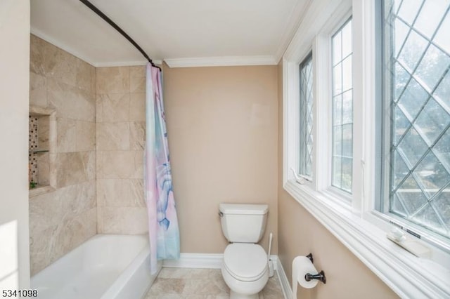 bathroom featuring baseboards, toilet, ornamental molding, tile patterned floors, and shower / bath combination with curtain