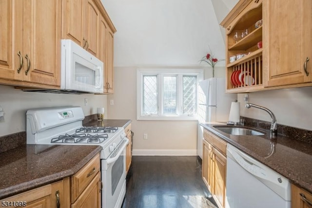 kitchen with open shelves, a sink, dark stone counters, white appliances, and baseboards