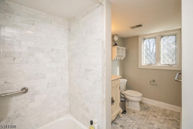 bathroom featuring shower / bath combination, visible vents, toilet, vanity, and baseboards