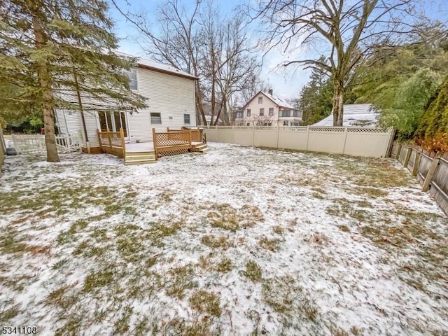 view of yard with a fenced backyard and a wooden deck