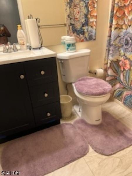 full bath with tile patterned floors, toilet, a shower with shower curtain, and vanity