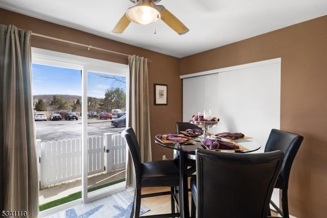 dining room with a ceiling fan