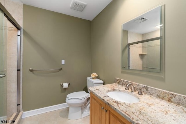 bathroom featuring toilet, a shower stall, and visible vents