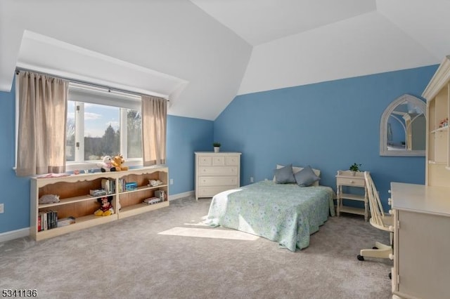 bedroom with carpet floors, baseboards, and vaulted ceiling