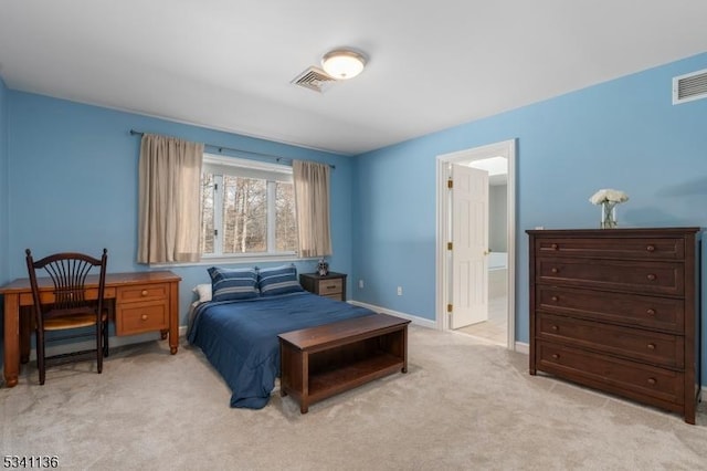 bedroom with baseboards, visible vents, and light colored carpet