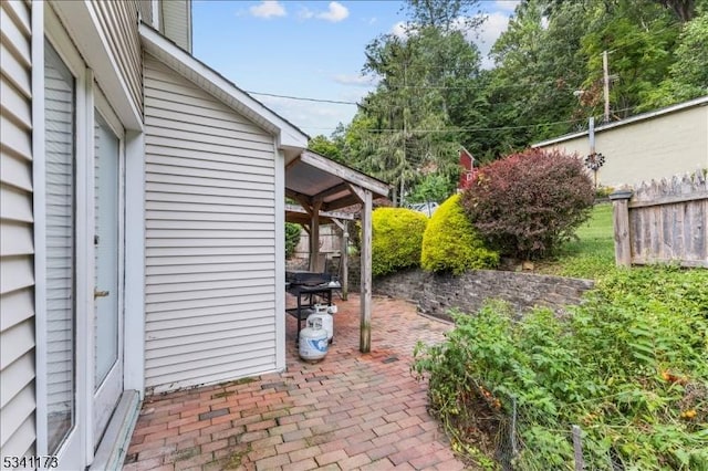 view of patio featuring fence