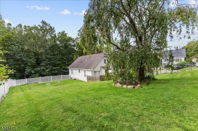 view of yard with a fenced backyard