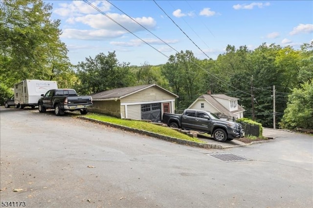 view of front of home with an outbuilding and a detached garage