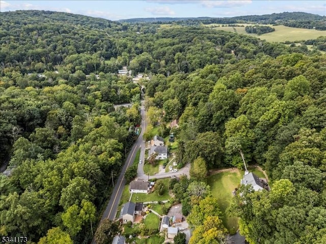 bird's eye view featuring a forest view