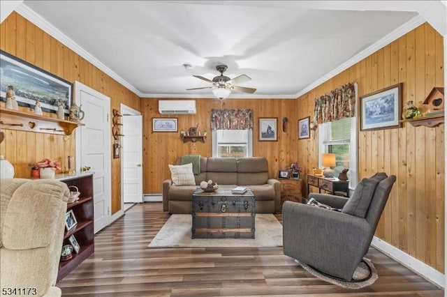 living area featuring a wall unit AC, ornamental molding, a ceiling fan, wooden walls, and wood finished floors