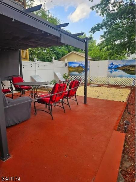 view of patio / terrace featuring fence and outdoor dining space