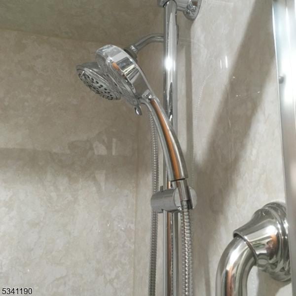 bathroom view of a sink and a shower
