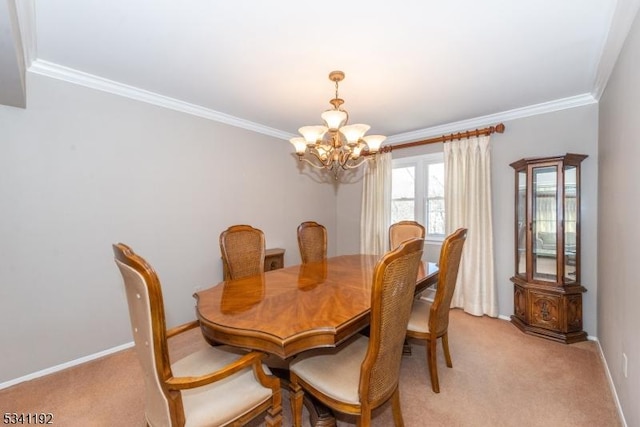 dining room with crown molding, an inviting chandelier, baseboards, and light colored carpet