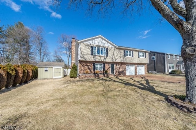 view of front of property featuring a storage shed, a chimney, an outdoor structure, a front lawn, and brick siding