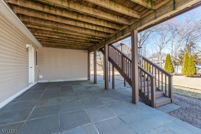 view of patio / terrace featuring stairs