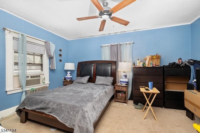 carpeted bedroom featuring cooling unit, baseboards, a ceiling fan, and crown molding