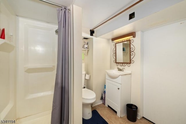 bathroom with tile patterned flooring, toilet, vanity, and a shower with curtain