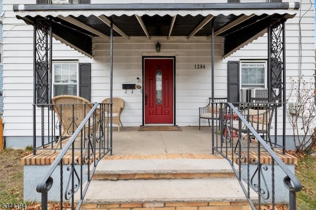 doorway to property featuring a porch