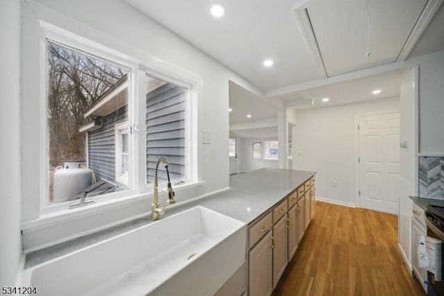 kitchen featuring wood finished floors and recessed lighting