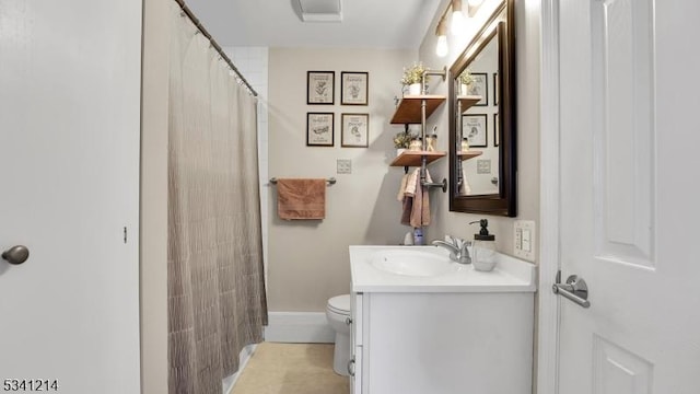 full bathroom with toilet, vanity, and a shower with curtain